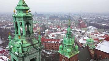 Aerial view of Wawel royal Castle and Cathedral, Vistula River, park, promenade and walking people in winter. Poland video