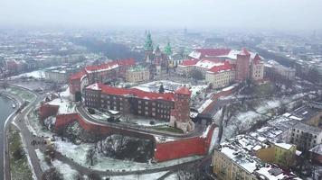 Aerial view of Wawel royal Castle and Cathedral, Vistula River, park, promenade and walking people in winter. Poland video