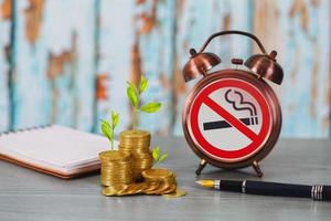 Money grow up because not smoking ,business concept. photo