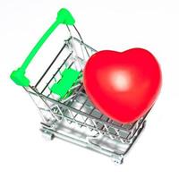 red heart ball in shopping cart photo