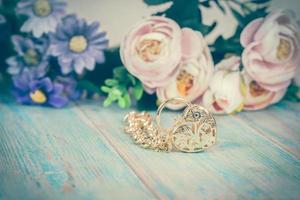 gold bracelet with heart on color wood photo