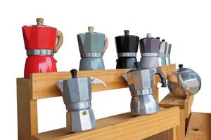 Aluminum italian espresso coffee pot  on a wood table.Moka pot. photo