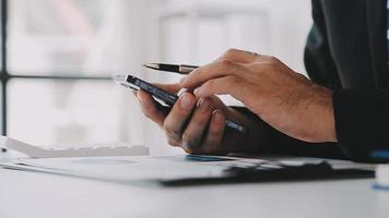 Financial analysts analyze business financial reports on a digital tablet planning investment project during a discussion at a meeting of corporate showing the results of their successful teamwork. video
