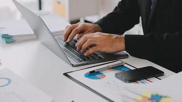 Financial analysts analyze business financial reports on a digital tablet planning investment project during a discussion at a meeting of corporate showing the results of their successful teamwork. video