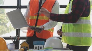 Construction and structure concept of Engineer or architect meeting for project working with partner and engineering tools on model building and blueprint in working site, contract for both companies. video