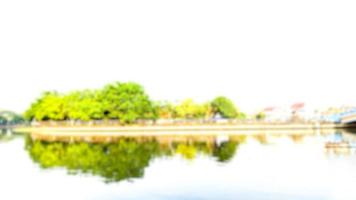 Blurred city scene bokeh reflecting river background photo