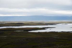 Icelandic coastline, ocean and field photo