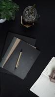 Flat lay Minimalist Lifestyle green black and white vertical video 15s, notebook and cool drink.