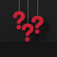 Red question marks on black room. FAQ Concept. photo