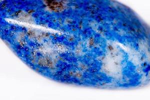 Macro mineral stone blue lapis lazuli afghanistan on white background photo