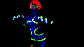 female disco raver girl poses in UV costume with spinning led poi lights video