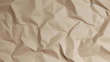 close up of crumpled brown paper texture background with copy space photo