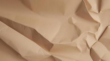 close up of crumpled brown paper texture background with copy space photo