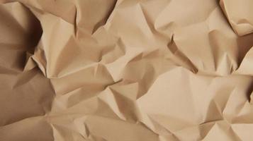 close up of crumpled brown paper texture background with copy space photo