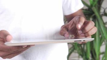 Man hand using digital tablet browsing internet video