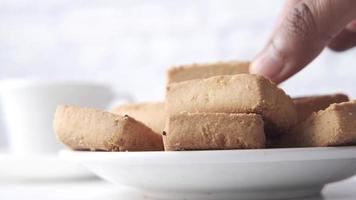 Close up of sweet cookies on wooden table video