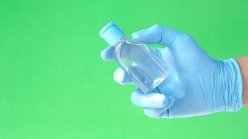 close up of doctor hand in latex gloves holding hand sanitizer video