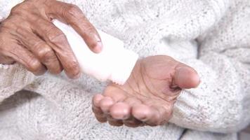 Close up of medical pills on senior woman's hand video