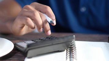 Close up of man hand using calculator video