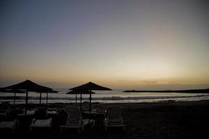 picturesque ocean landscape with the setting sun in a tropical country during summer holidays photo