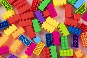 Colorful plastic building block patterns isolated. Toy for children photo