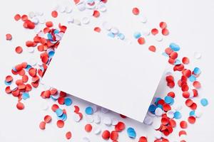 business card mockup on colorful circle confetti, decorations for fourth july photo