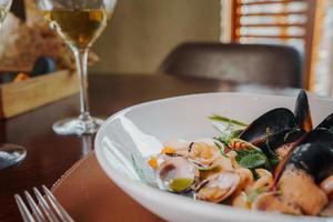 Close up view of the grilled scallop on a plate photo