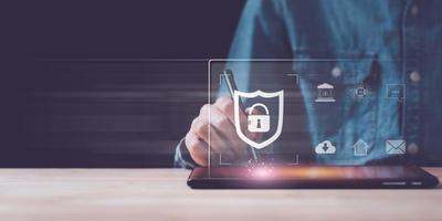 Businessman showing data access protection with key icon ,safety technology ,Login to the online database ,Data protection and privacy with encryption ,Connecting Software with Authentication photo