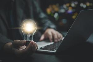 hand hold light bulb.Inspiration and Creativity Concepts.Innovation technology in science and communication network connection. photo