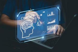 businessman using laptop computer chatting with a smart AI or artificial intelligence. Digital technology robot information concept. photo