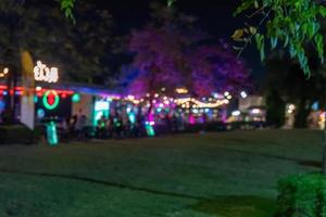 Blurred people eat at restaurants outside. For a background image photo