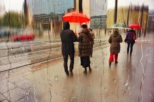 Bilbao, Vizcaya, Spain, 2023 - people with an umbrella in rainy days in winter season, bilbao, basque country, spain photo