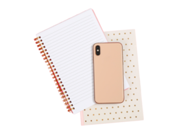 Pink notebook and cellphone isolated on a transparent background png