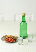 Soju Bottle and Side Dish Food, Topokki and Fries photo