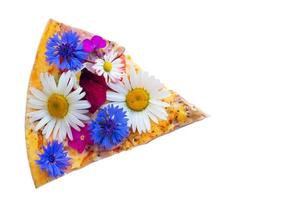 Creative pizza piece covered with colorful flowers. photo