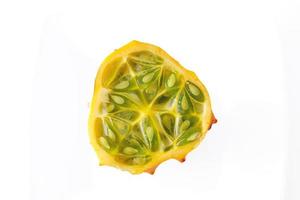 tasty healthy kiwano fruit on white isolated background macro closeup photo