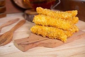 selective focus on banana nuggets coated with flour panir or breadcrumbs. soft focus photo