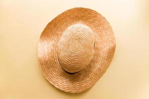 Flat lay hat on yellow background photo