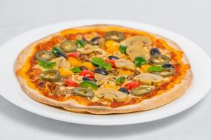 Closeup of Chicken mushroom jalapeno and red pepper pizza on white plate isolated on white background. Homemade Pizza. photo