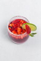 Classic frozen strawberry and lime margarita with fresh strawberries. Valentine's dessert recipe. Strawberry juice. photo