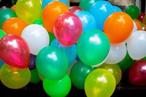 A lot of colorful balloons close-up views. Balloons of many colours. Colorful balloons background. photo