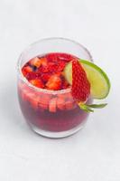 Classic frozen strawberry and lime margarita with fresh strawberries. Valentine's dessert recipe. Strawberry juice. photo