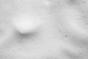 Abstract white soap foam bubbles texture background photo