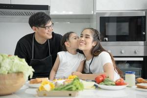 New home for family. activities together during the holidays. Parents and children are having activity on vacant time. weekend, enjoyment, happy family, togetherness, feel good. Kitchen photo