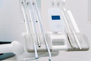 Modern dental equipment in dentist clinic. Dentists tools for treatment and surgery of teeth. photo