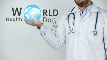 Doctor with a stethoscope around his neck and the words World Health Day photo