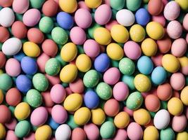A pile of colorful easter eggs with the word easter on the top. photo