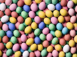 A pile of colorful easter eggs with the word easter on the top. photo