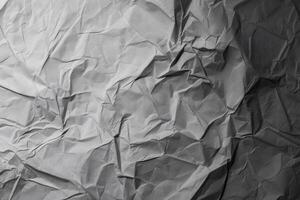 Design space grey crumpled paper textured background. photo