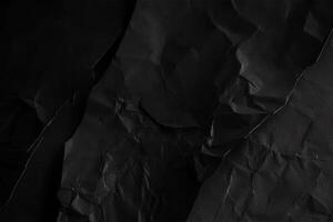 Design space black and dark crumpled paper textured background. photo